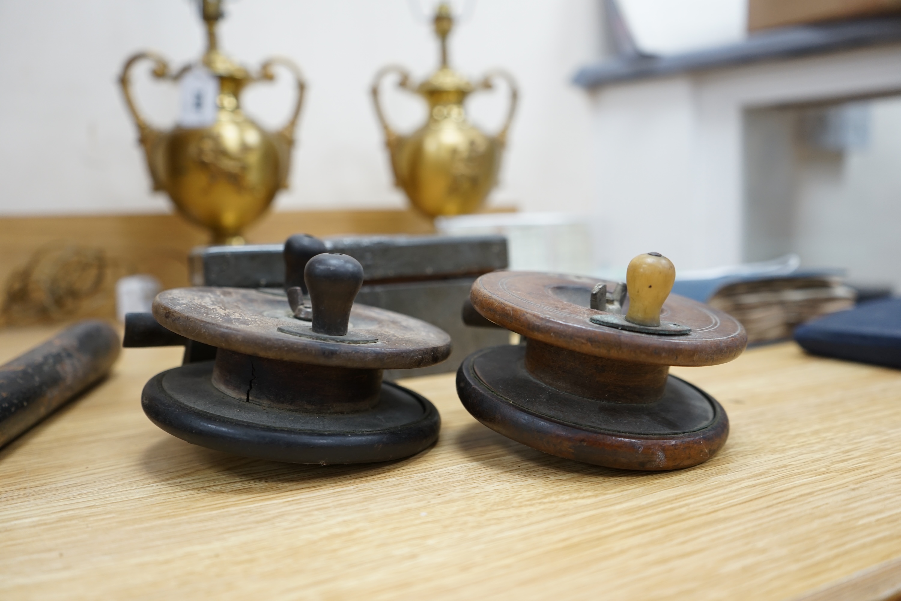 Two wooden fishing reels, a Victorian truncheon and an Arts and Crafts pewter box with enamel roundel. Truncheon 43cm long., Condition - all items worn